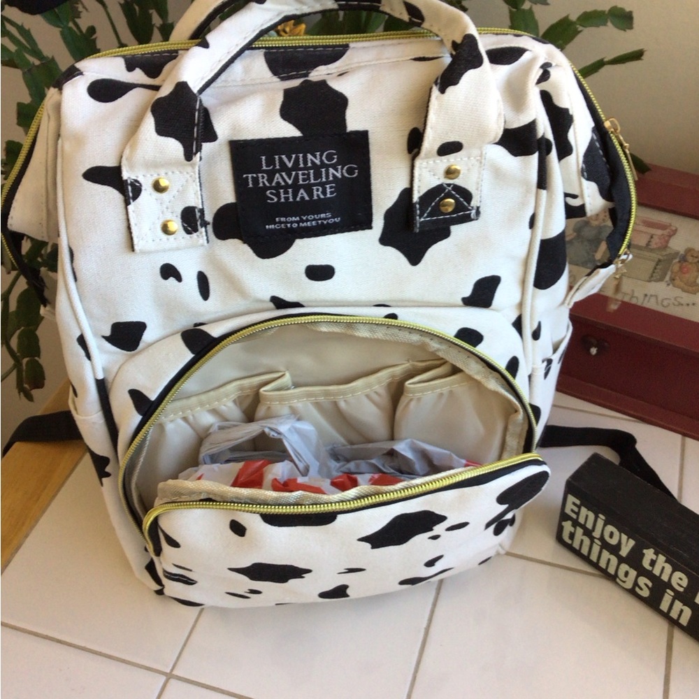 ‘Living Traveling Share’ Canvas Cow Print Backpack - Picture 4 of 8